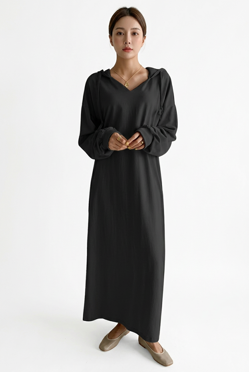 Full-body front view of a black hooded V-neck maxi sweater dress with long sleeves on a white background